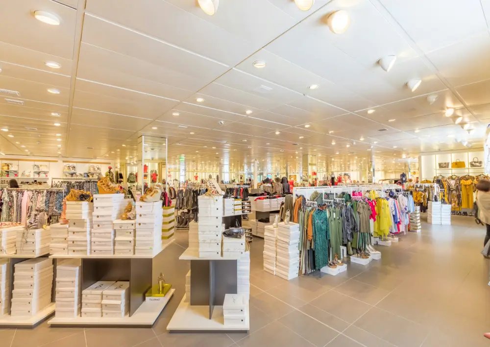 Spacious retail shop in Greater Noida featuring modern interiors, branded clothing, footwear, and lifestyle products in a premium commercial project.